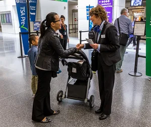 Airport Butler assisting airport passengers